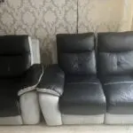 2x 2 seater black leather and grey suede recliner sofas