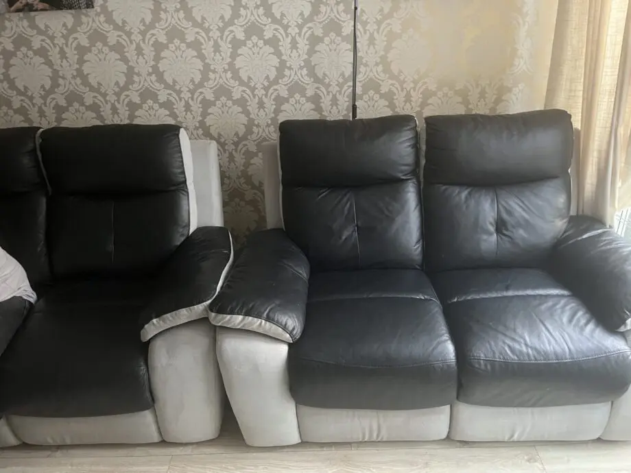 2x 2 seater black leather and grey suede recliner sofas