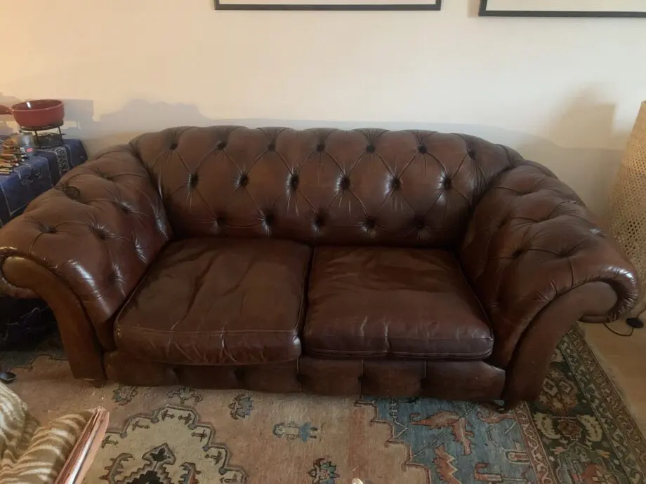 Chocolate brown leather Chesterfield style sofa