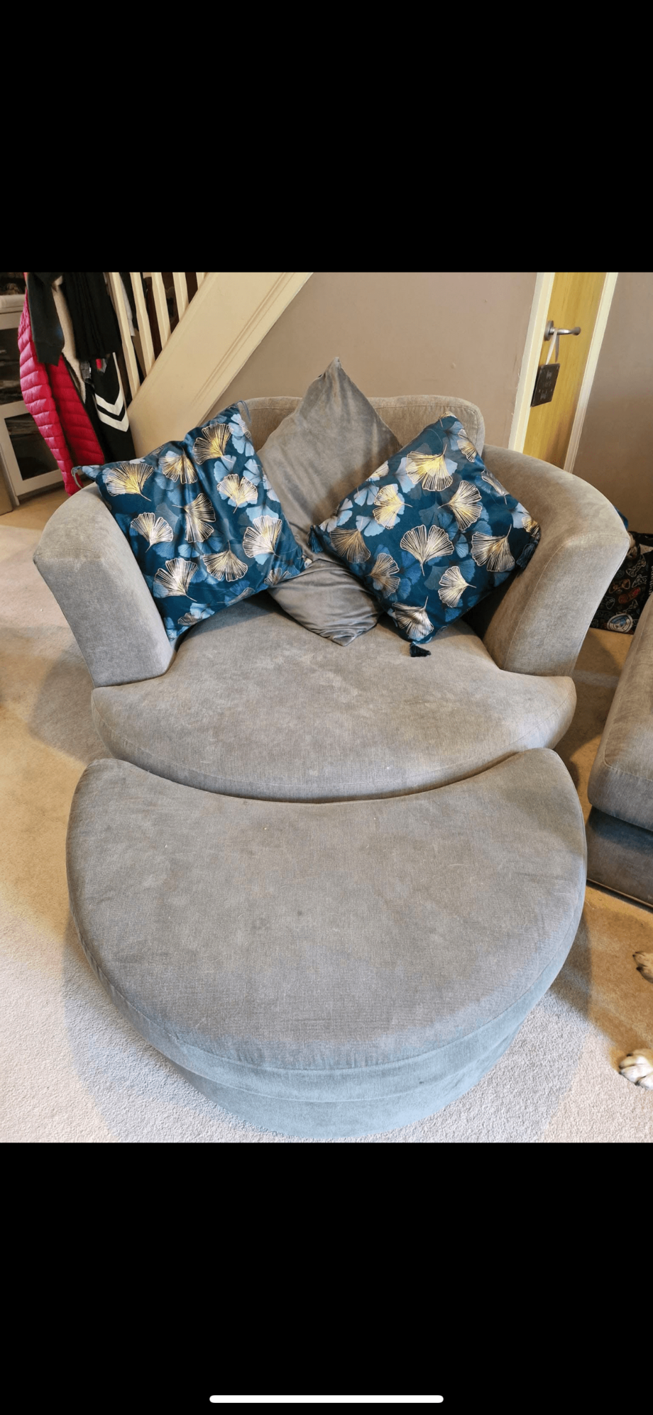 DFS Grey swivel chair with footstool