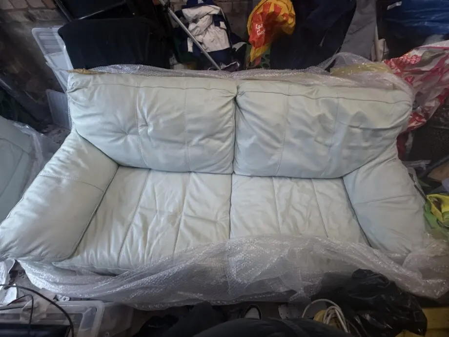 Double and single baby blue leather sofa