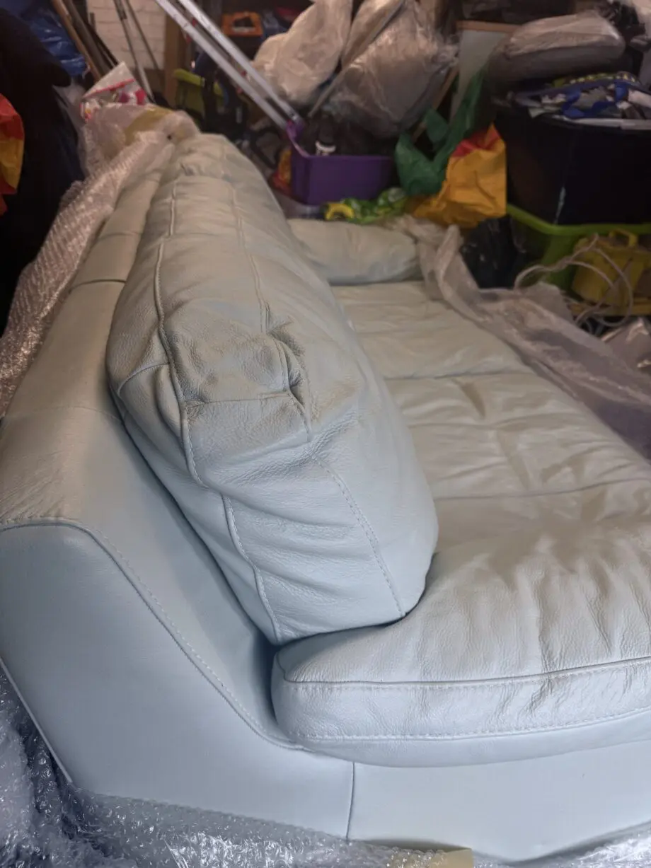 Double and single baby blue leather sofa