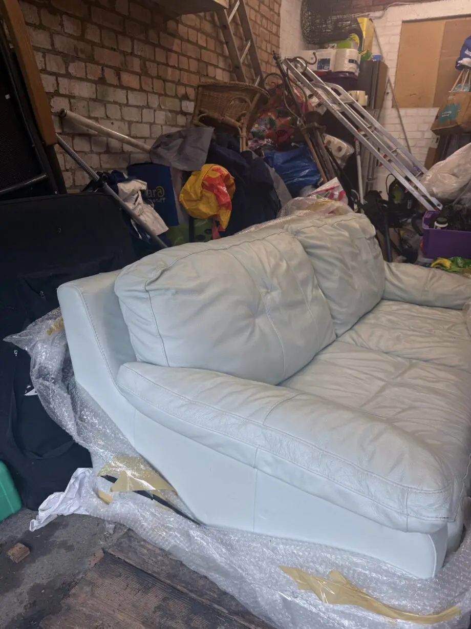 Double and single baby blue leather sofa