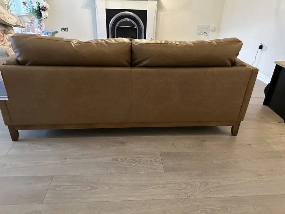 Brown faux leather sofa