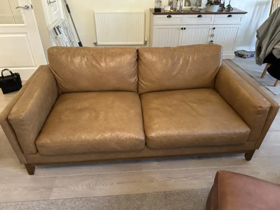 Brown faux leather sofa