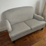 High-back French Louis-style two-seater sofa