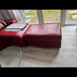 Red leather L shaped sofa bed