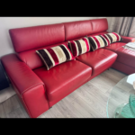 Red leather L shaped sofa bed