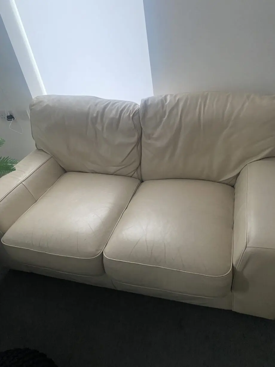 A fairly used cream sofa