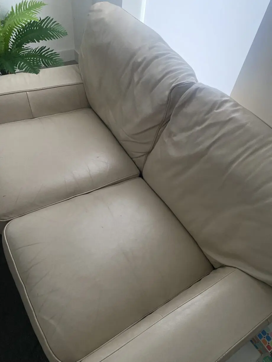 A fairly used cream sofa