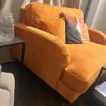 Luxury orange velvet loveseat with ottoman stool
