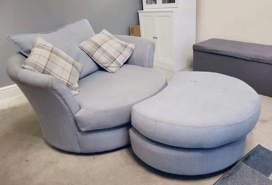 DFS Owen blue combination swivel chair, half moon foot stall and 2 pillows