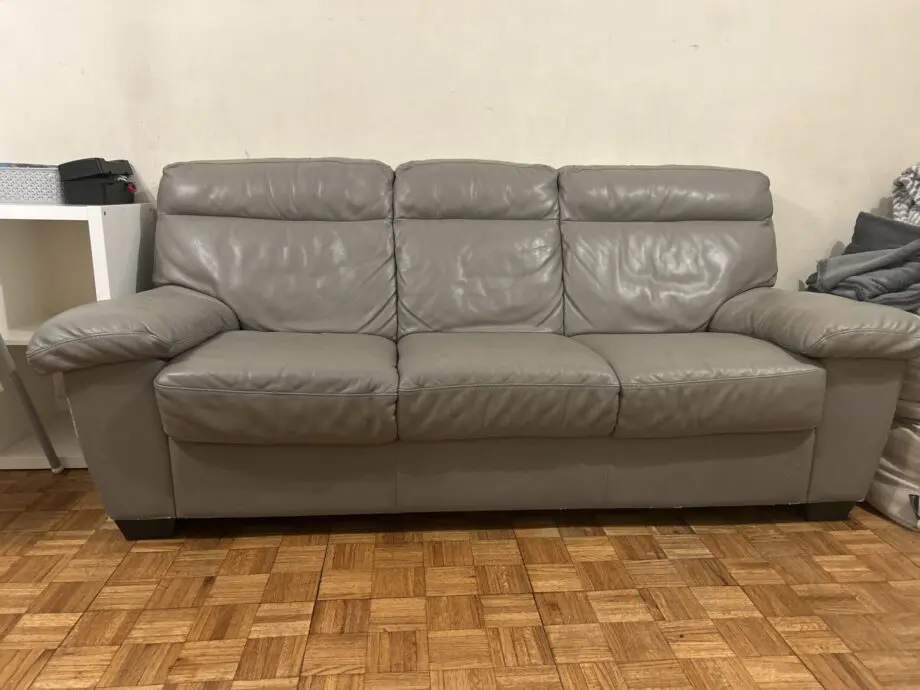 Grey leather 3 seater sofas x2