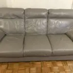 Grey leather 3 seater sofas x2