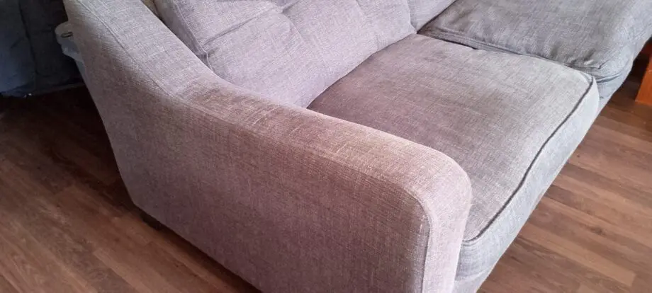 Grey two seater sofa