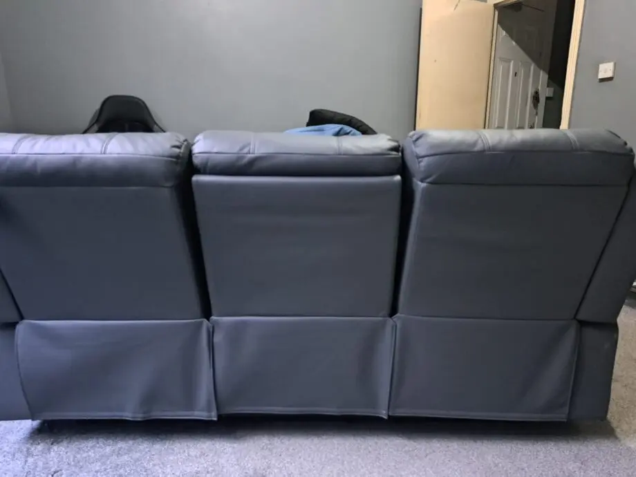 3 seater recliner sofa grey with two cup rest in the middle
