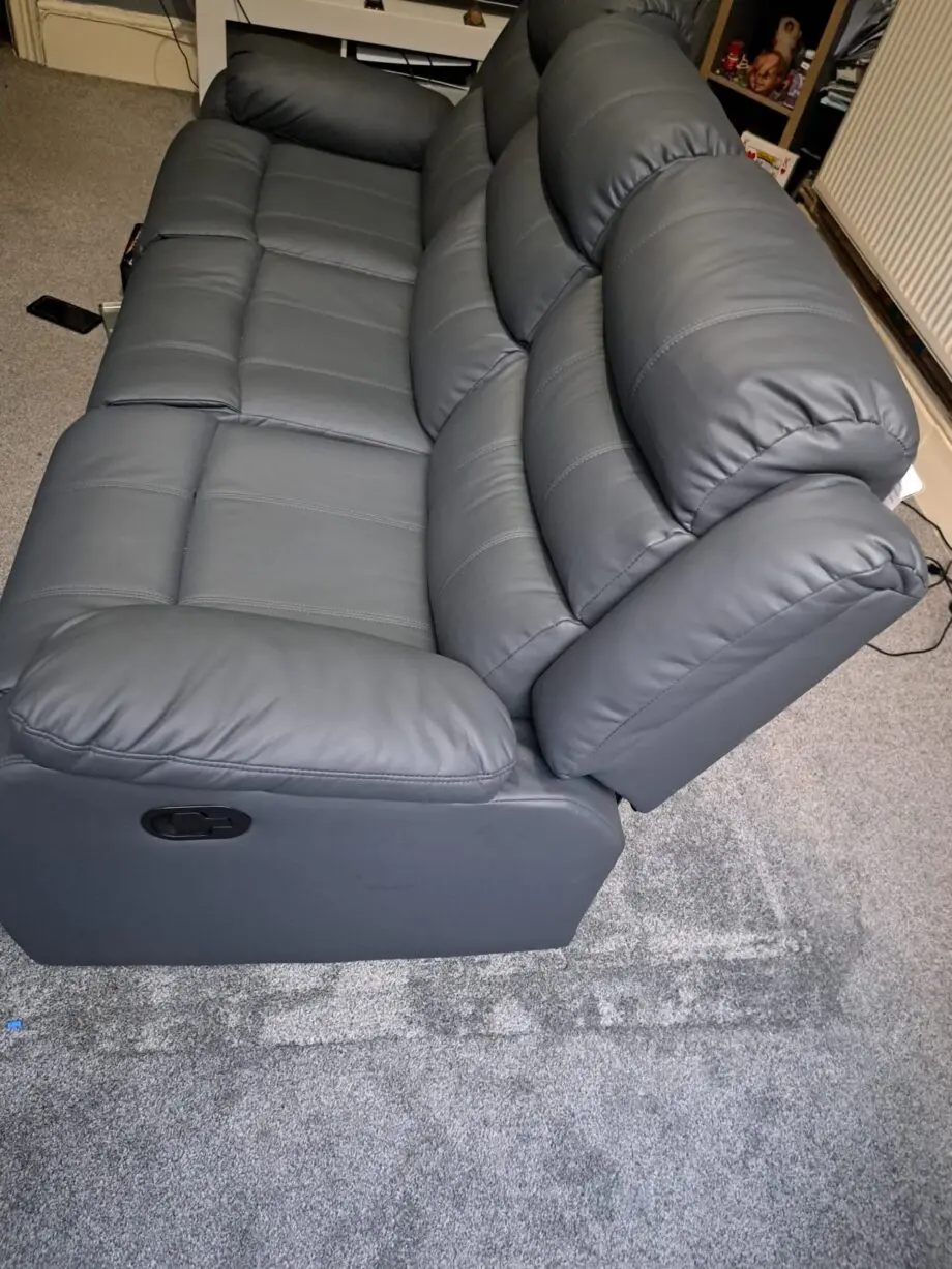 3 seater recliner sofa grey with two cup rest in the middle
