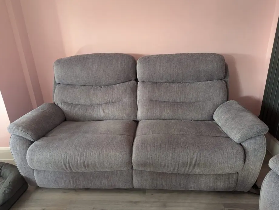 3 piece suite and foot stool from Fabb Furniture. Style is James and colour is lavender grey. Power recliner sofas