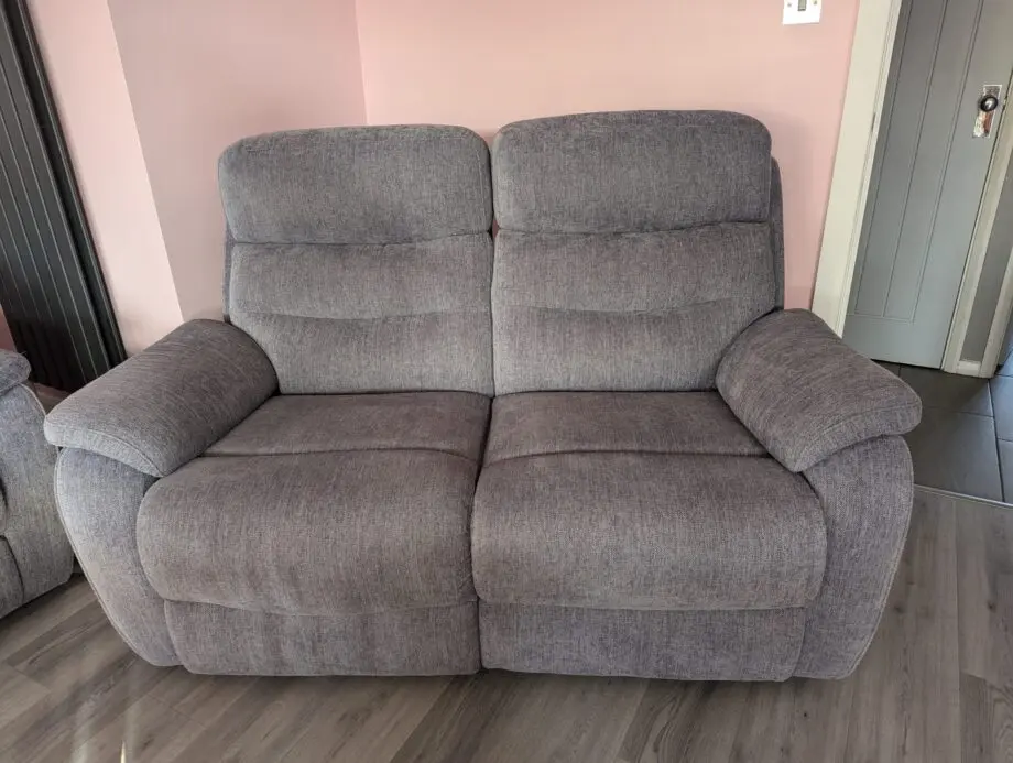3 piece suite and foot stool from Fabb Furniture. Style is James and colour is lavender grey. Power recliner sofas