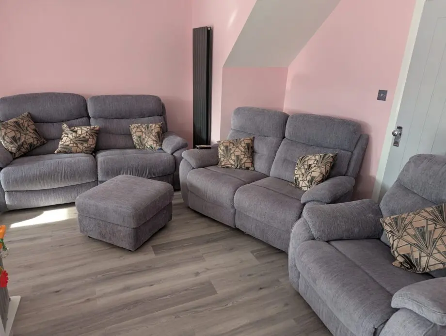 3 piece suite and foot stool from Fabb Furniture. Style is James and colour is lavender grey. Power recliner sofas