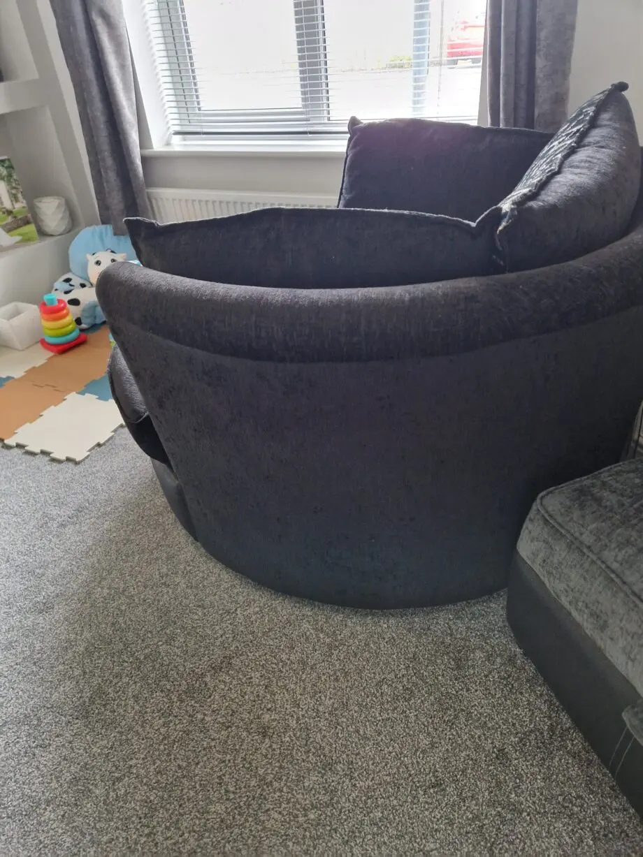 DFS OLLIE large swivel chair in black and charcoal combination.