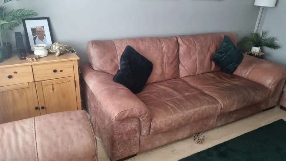 1 year old brown Italian leather sofa