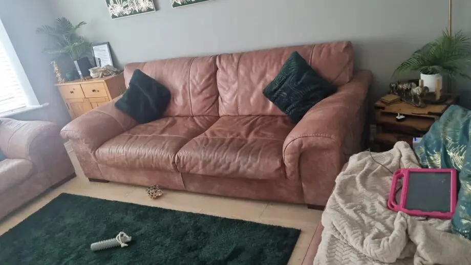 1 year old brown Italian leather sofa