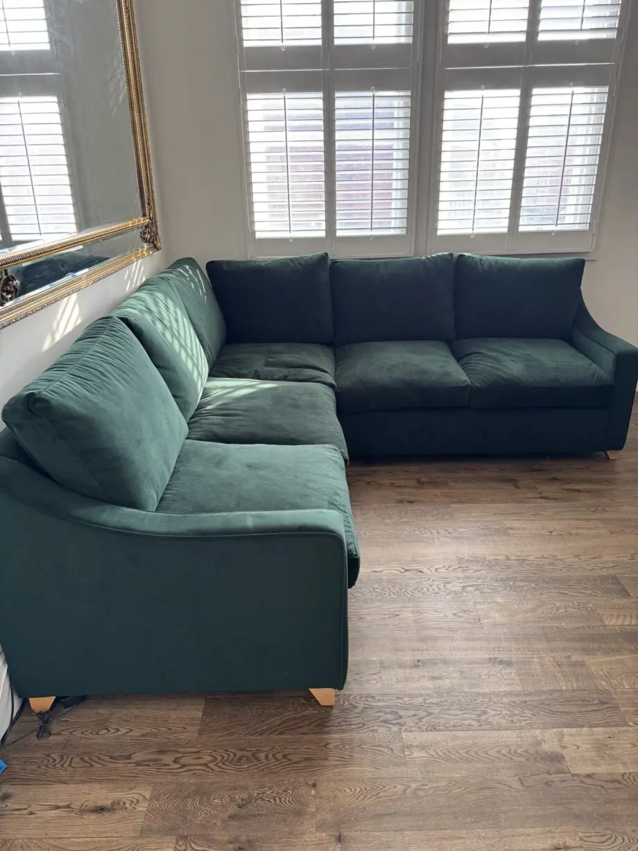 Willow and hall 7 seat Bisford corner sofa in hunter green coloured luxurious velvet. Seat cushions in beautiful soft feather wrapped foam. Removable arms for easier installation.