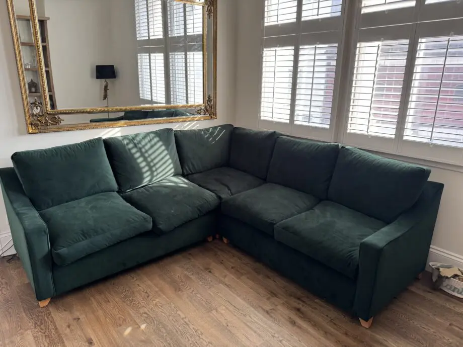 Willow and hall 7 seat Bisford corner sofa in hunter green coloured luxurious velvet. Seat cushions in beautiful soft feather wrapped foam. Removable arms for easier installation.