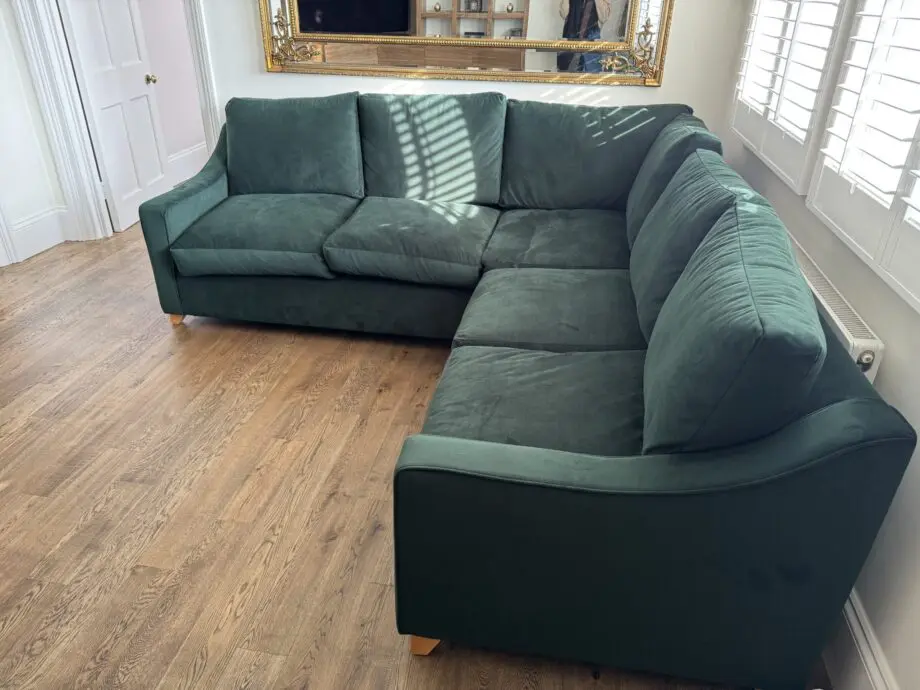 Willow and hall 7 seat Bisford corner sofa in hunter green coloured luxurious velvet. Seat cushions in beautiful soft feather wrapped foam. Removable arms for easier installation.