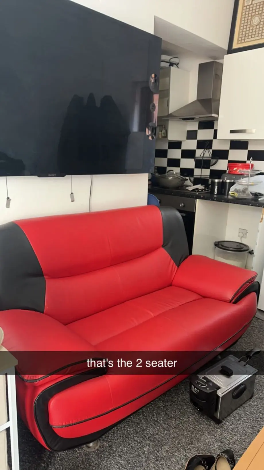 red and black leather sofa