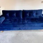 Navy velvet sofa bed with ottoman
