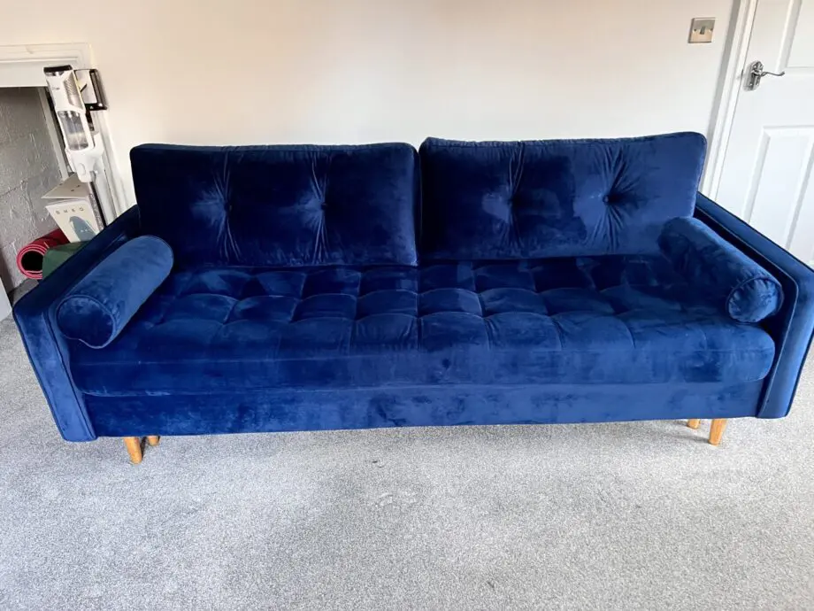 Navy velvet sofa bed with ottoman