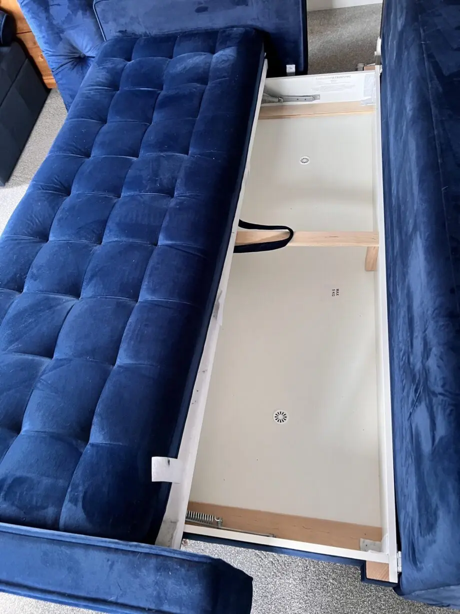 Navy velvet sofa bed with ottoman