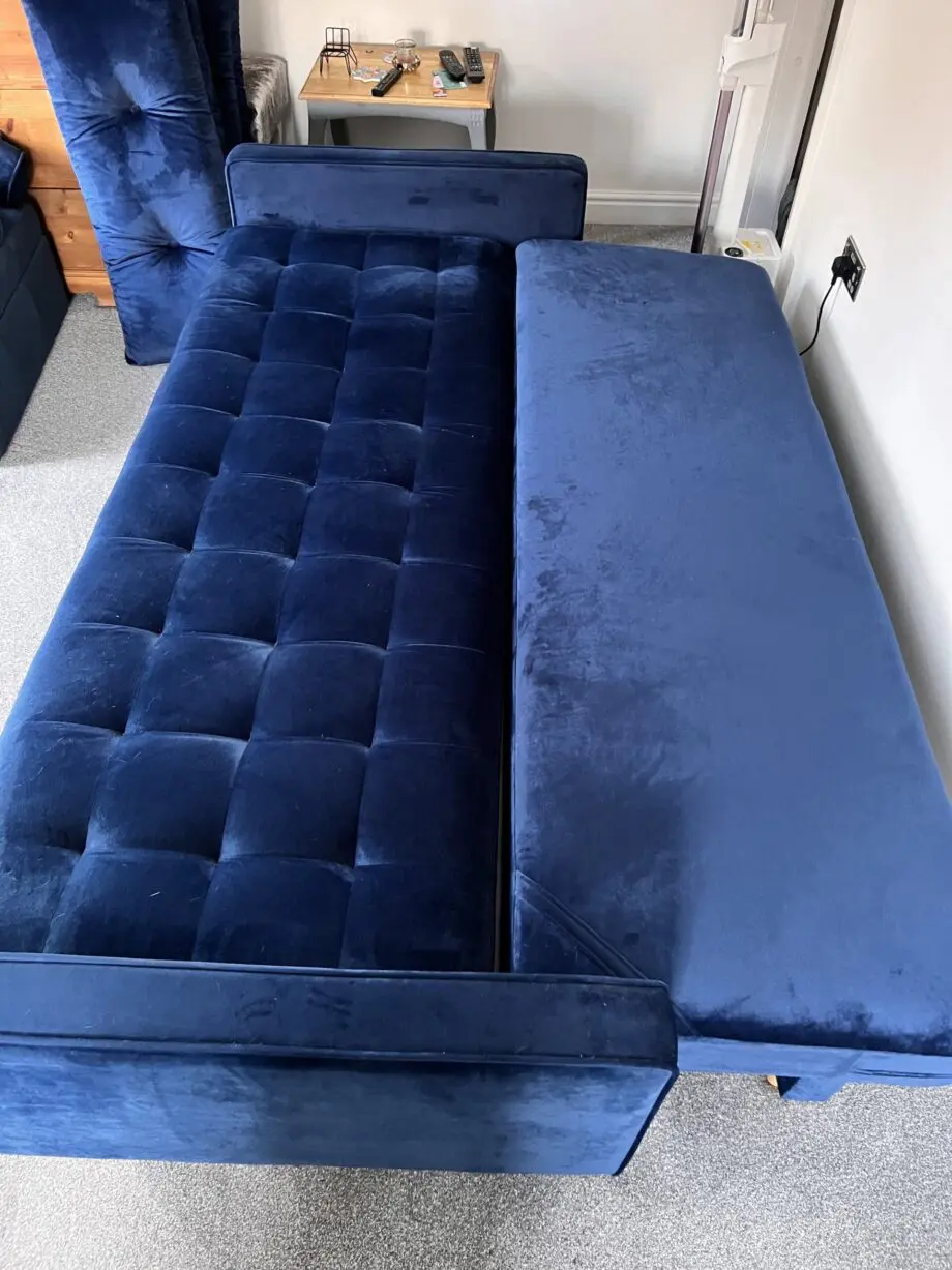 Navy velvet sofa bed with ottoman