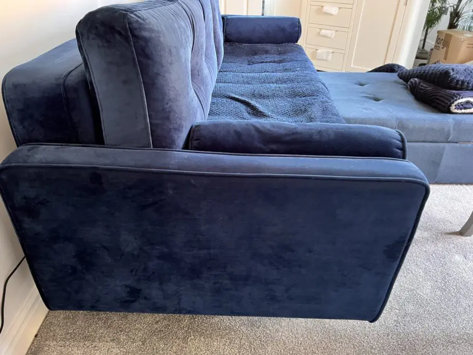 Navy velvet sofa bed with ottoman