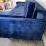 Navy velvet sofa bed with ottoman