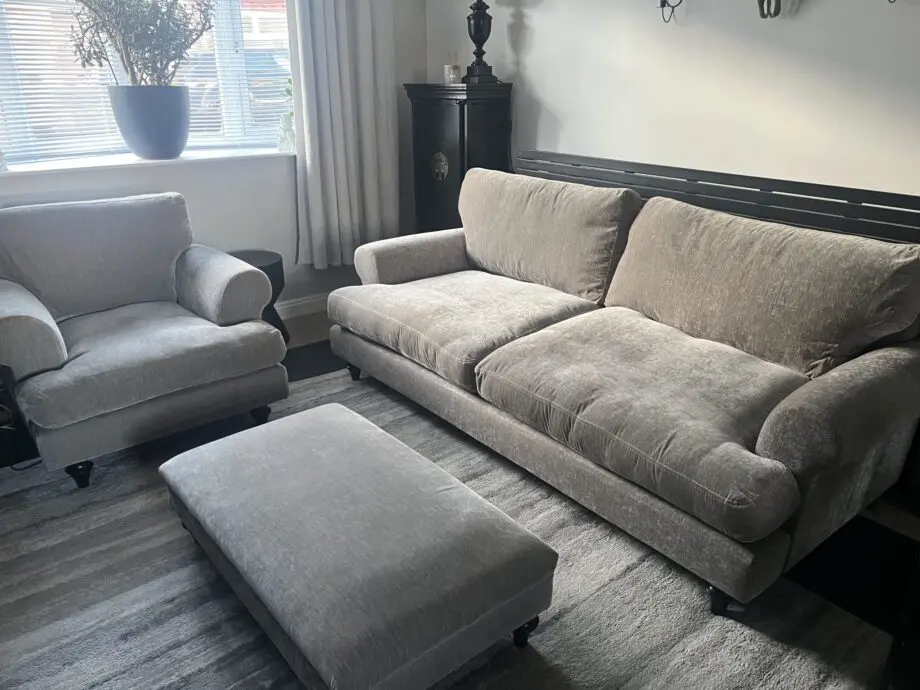 Taupe four seater sofa. armchair and footstool
