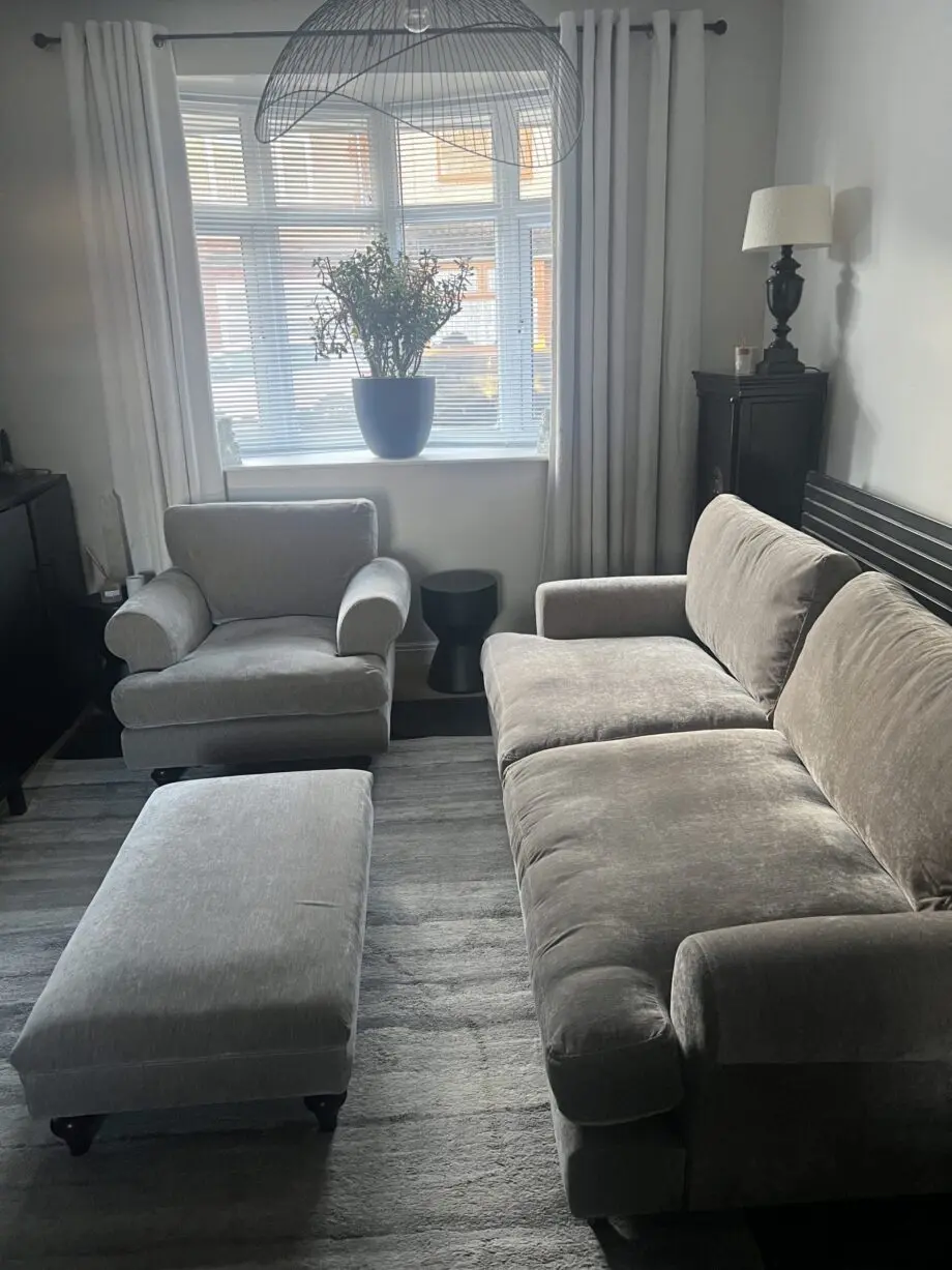Taupe four seater sofa. armchair and footstool