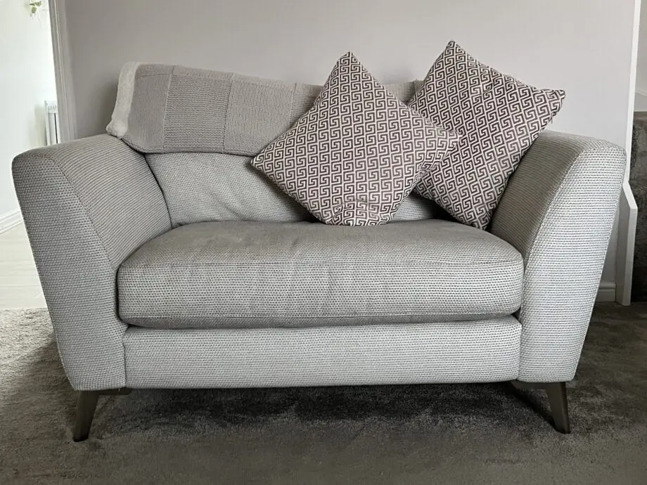 3 seater sofa and cuddle chair, from DFS and brand is house beautiful, name-Libby and colour is Silver combination