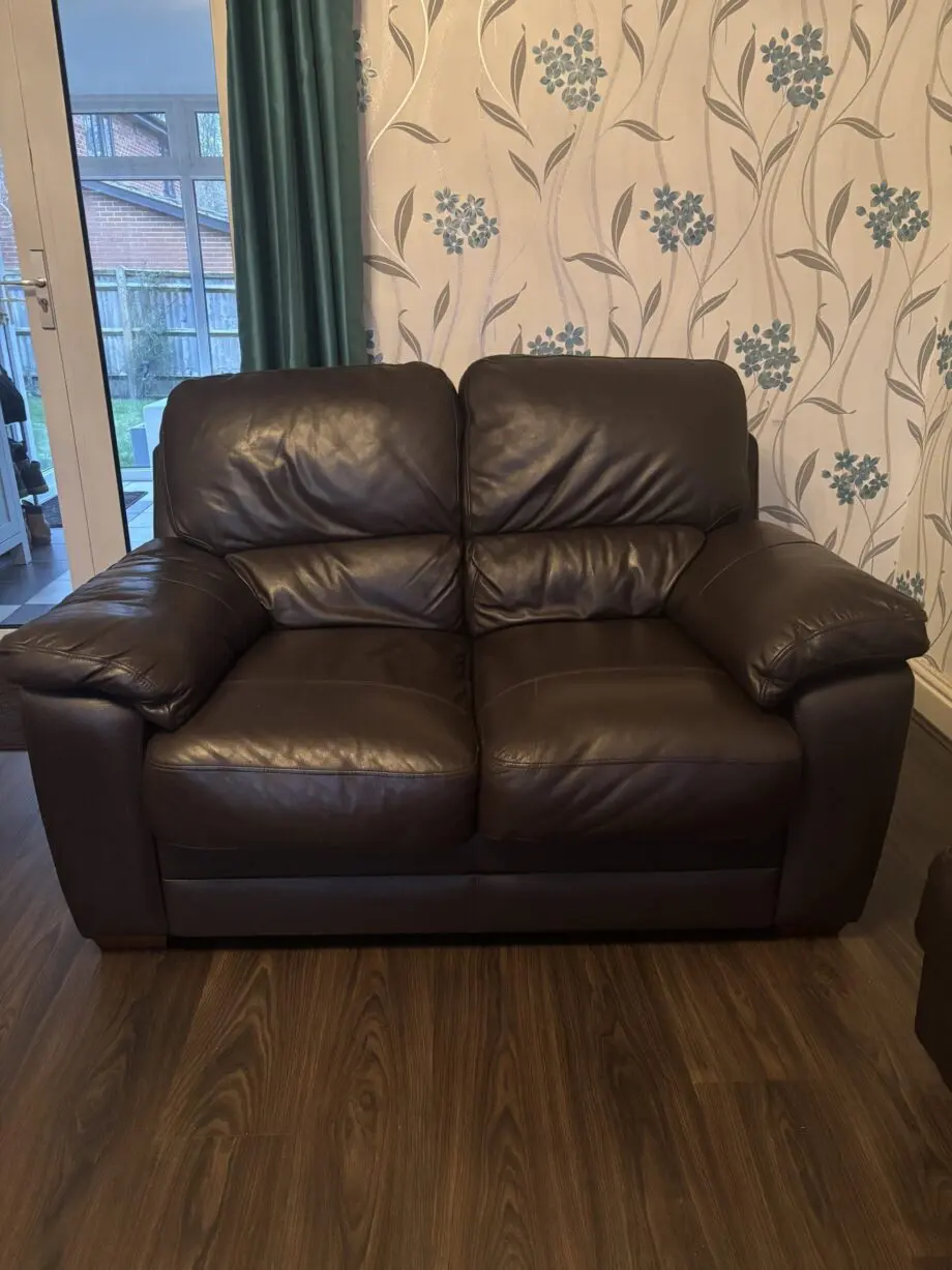 Brown leather sofa and foot stool