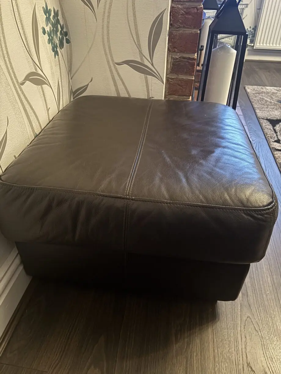 Brown leather sofa and foot stool