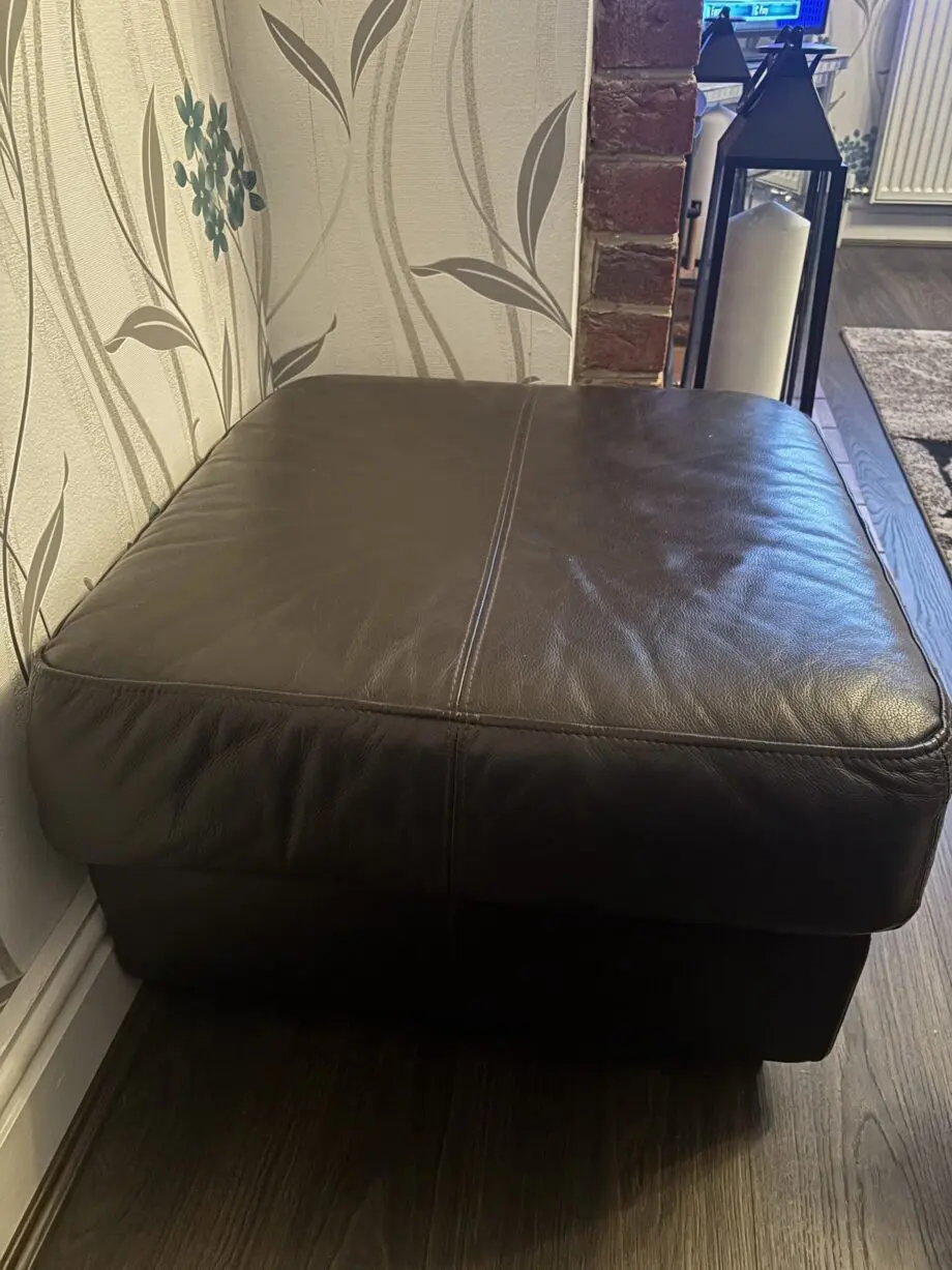 Brown leather sofa and foot stool