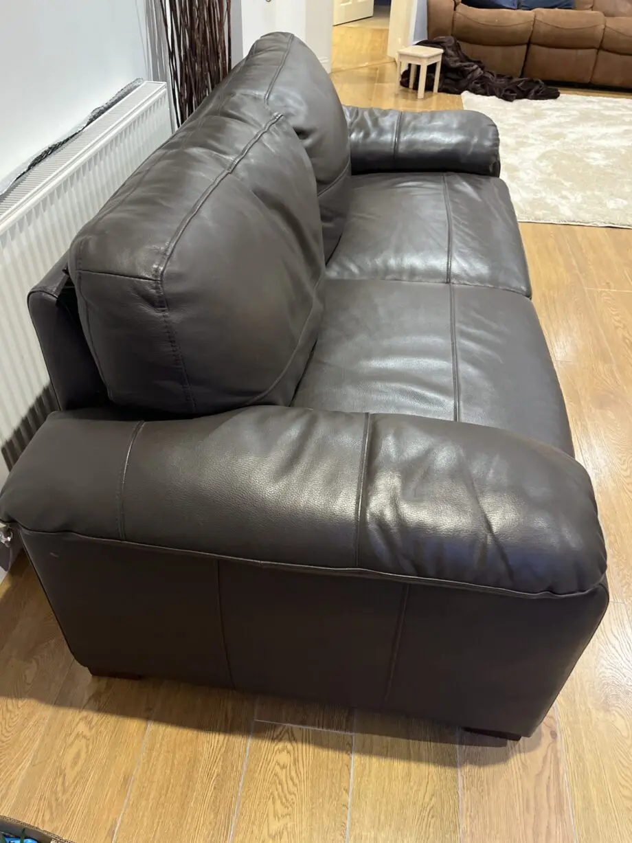 Two leather brown three seater sofas