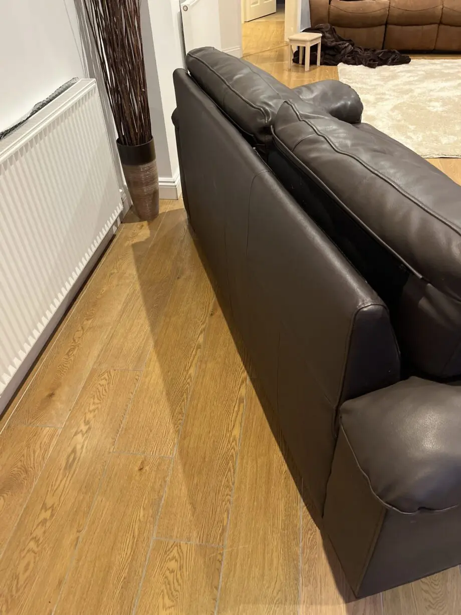 Two leather brown three seater sofas