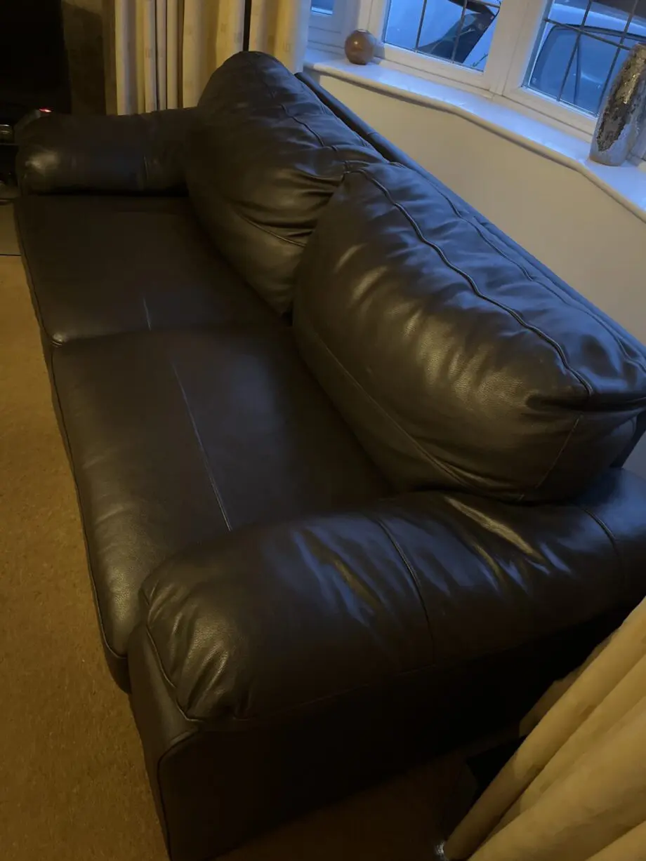Two leather brown three seater sofas