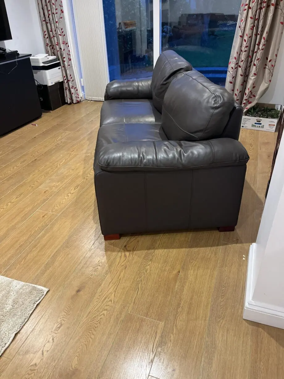 Two leather brown three seater sofas