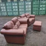Two Brown Two-Seater Sofas & Footstool