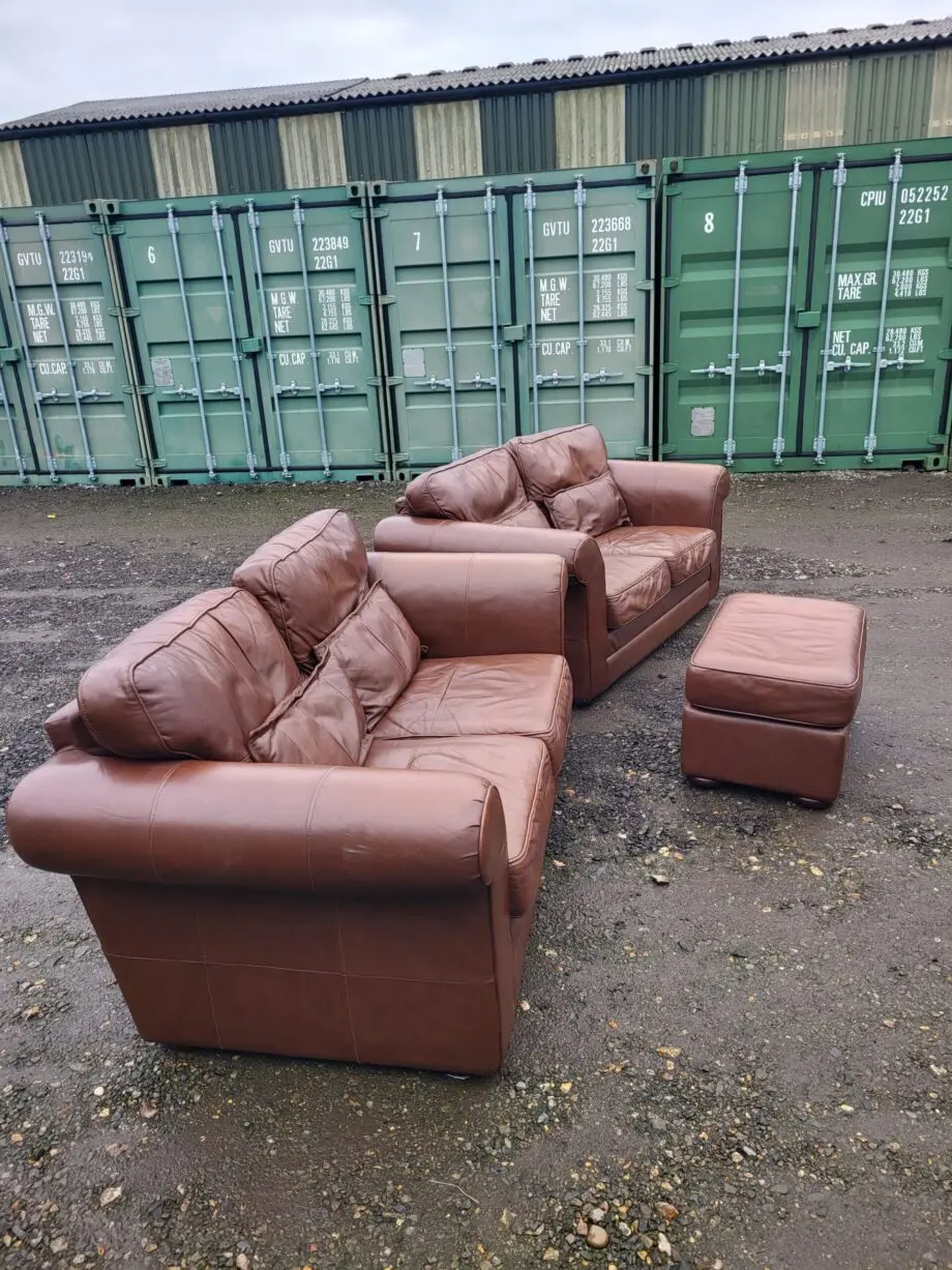 Two Brown Two-Seater Sofas & Footstool