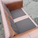Two Brown Two-Seater Sofas & Footstool